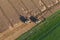 Aerial view of combine on harvest fields