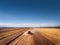 Aerial view of Combine harvester agriculture machine harvesting