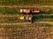 Aerial view of Combine harvester agriculture machine harvesting golden wheat field