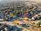 Aerial view community playground near urban sprawl with colorful