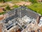 Aerial view of Concrete or CPAC cement roof tiles on the new roof are under construction. residential building. Infrastructure of