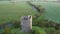 Aerial view of Conna Castle in county Cork, Ireland, a ruined five storey square tower house about 85 feet tall built in 1550