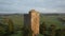 Aerial view of Conna Castle in county Cork, Ireland, a ruined five storey square tower house about 85 feet tall built in 1550