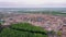 Aerial view on construction area of large modern sporting arena, huge building cranes