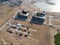 Aerial view of a Construction crane tower. Top view Crane and building working progress. Worker. Construction Site view by drone.