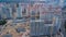 Aerial view of construction site of residential area buildings with cranes at sunset from above, urban skyline