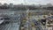 Aerial view of construction site with unfinished steel frame buildings