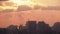 Aerial view of Construction Sites, Cranes and Skyscrapers Silhouettes at Sunset