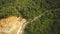 Aerial view Construction work beside the green forest at Asia