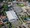 Aerial view of a consumer market with a large empty parking lot for cars in a suburb in northern Germany