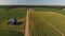 Aerial view of corn fields and a dirt road. Summer country landscape.