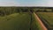 Aerial view of corn fields and a dirt road. Summer country landscape.