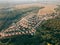 Aerial view of a cottage town with identical houses