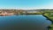 Aerial view of country houses on the hill on shore of the pond in the morning