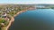 Aerial view of country houses on the hill on shore of the pond in the morning