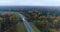 Aerial view country road in forest.