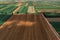 Aerial view of countryside farming field patchwork from drone pov