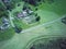 Aerial view of countryside in summer. Bird`s eye view of village in wooded area