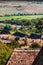 Aerial view of a countryside with vegetation, fields and houses in Romania .