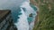 Aerial view of a couple diving snorkeling thru the corals on a paradise beach, during a romantic adventure vacations