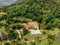 aerial view of couple resting at swimming pool near villa