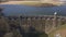 Aerial view of Craig goch elan valley. flying over dam white panning right