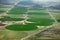 An aerial view of crop circles created by agricultural irrigation systems.