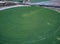 Aerial view of crop field with circular pivot irrigation sprinkler