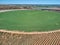 Aerial view of crop field with circular pivot irrigation sprinkler