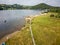 Aerial view of a crowded beach on the shore of a large lake in summer (Ullswater, Lake District, England