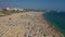 Aerial view of crowded Rocha beach in Portimao, Algarve, Portugal