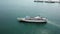 Aerial view cruise ship with background container terminal.