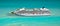 Aerial view of cruise ship on blue ocean.