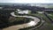 Aerial view curve river near water paddy