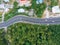 Aerial view curve road on mountain with tropical forest and car transport