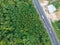 Aerial view curve road on mountain with tropical forest and car transport