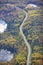 Aerial view of curving road and lakes and trees in northern Minnesota on a sunny autumn day