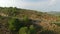 Aerial view of cyclist on high slope mountain road