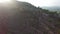 Aerial view of cyclist on high slope mountain road