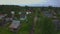 Aerial view of a cyclist riding a narrow suburban road. Country life.