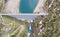 Aerial view of the dam of the Lake Fregabolgia, an Alpine artificial lake. Italian Alps. Italy