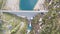 Aerial view of the dam of the Lake Fregabolgia, an Alpine artificial lake. Italian Alps. Italy