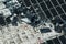 Aerial view of damaged by hurricane wind photovoltaic solar panels mounted on industrial building roof for producing