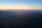 Aerial view of dark mountain hills at sunset. Hazy peaks and misty valleys in evening