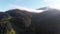 Aerial view of Dawn over the Mountains. Fog and Clouds Hovered Mountain Tops