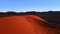 Aerial view of dazzling colourful dune in african desert. Magnificent contrast of natural landscape at sunset shot by