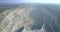 Aerial view deep dark canyon in asbestos quarry center