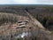 Aerial view deforestation tree cutting spring or autumn forest. Ecology.