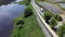 Aerial view of delivery truck on rural road beside bike trail