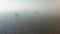 Aerial view of a dense smog or fog hanging over the city. Air environmental pollution concept